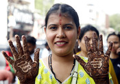 NEW DELHI,AUG 8 (UNI):-Girls gets mehandi applied on their hands on the eve of the Raksha Bandhan festival at Lajpat Nagar Market in Delhi on Friday.UNI PHOTO PV9U BY PUSHKAR VYAS. NEW DELHI,AUG 8 (UNI):-Girls gets mehandi applied on their hands on the eve of the Raksha Bandhan festival at Lajpat Nagar Market in Delhi on Friday.UNI PHOTO PV9U BY PUSHKAR VYAS.