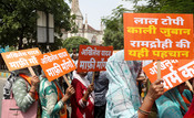 LUCKNOW, 15 JUL (UNI):- Activists of the Sanatan Raksha Sangathan take part in a protest march against Samajwadi Party chief Akhilesh Yadav over his statements regarding the Ayodhya Ram Mandir and alleged theft of donations at the temple, at Hazratganj crossing in Lucknow on Wednesday. UNI PHOTO-8U